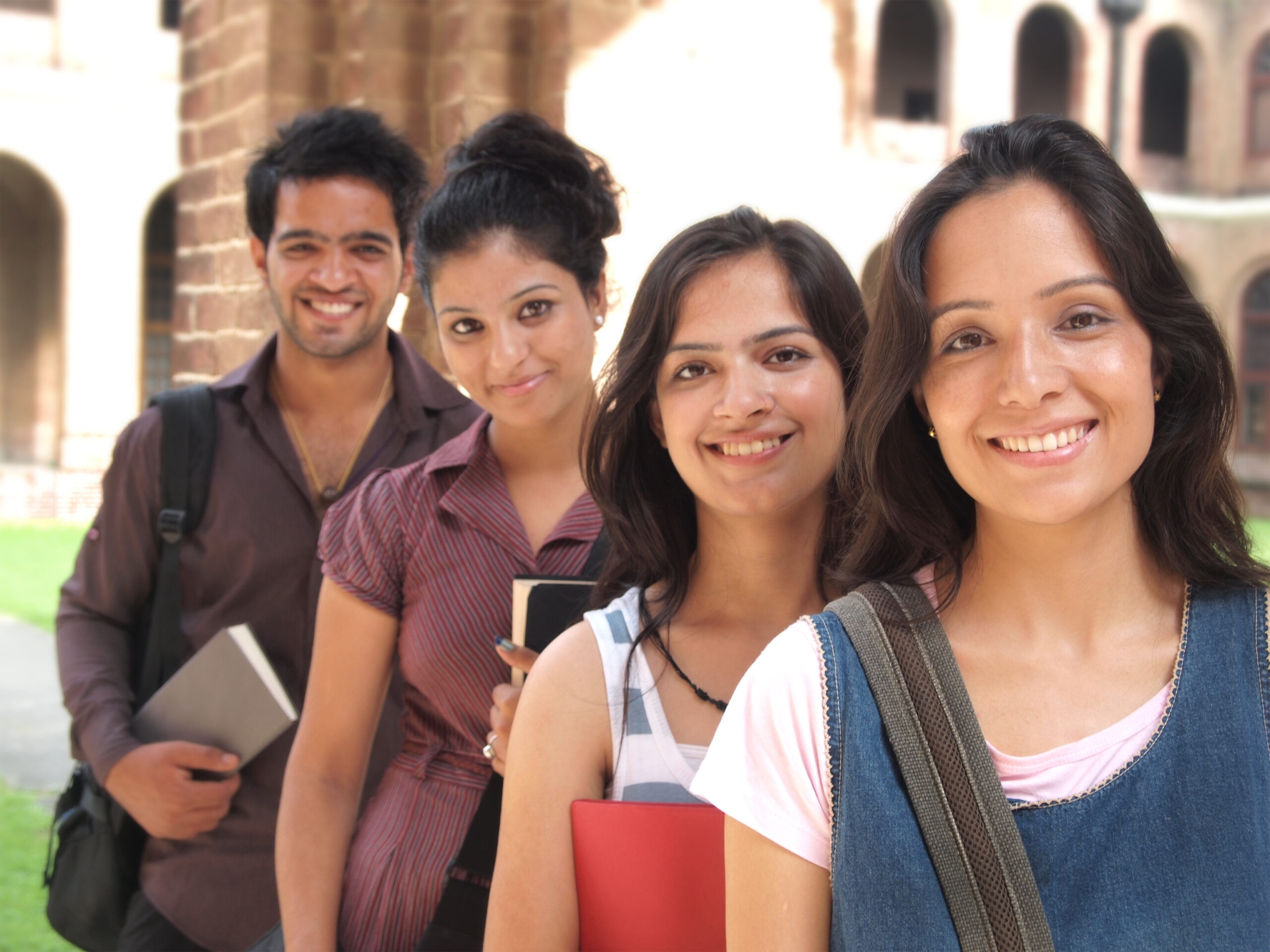 Group of young Indian / Asian college students in the campus.